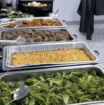 Hot buffet trays prepared by For Goodness Sakes